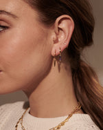 Load image into Gallery viewer, MURKANI - Huggie with Hanging Amethyst  Baguette in 18KT Yellow Gold Plate
